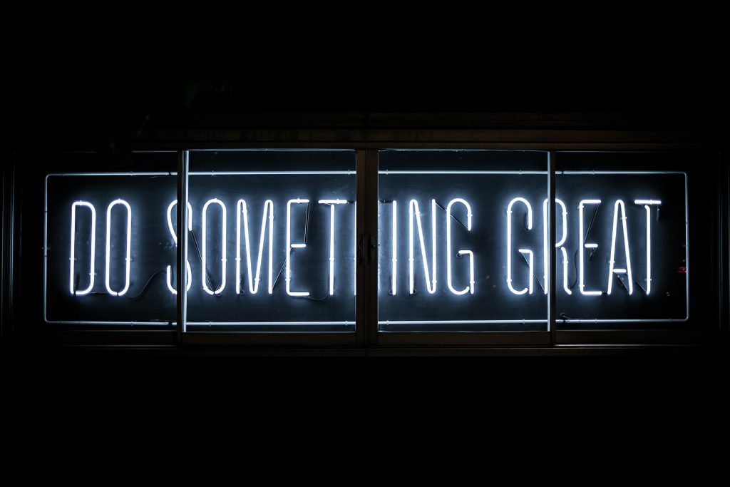 Neon sign reading: do something great
